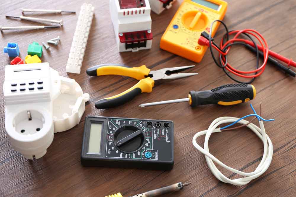 Different Electrical Tools On Wooden Table
