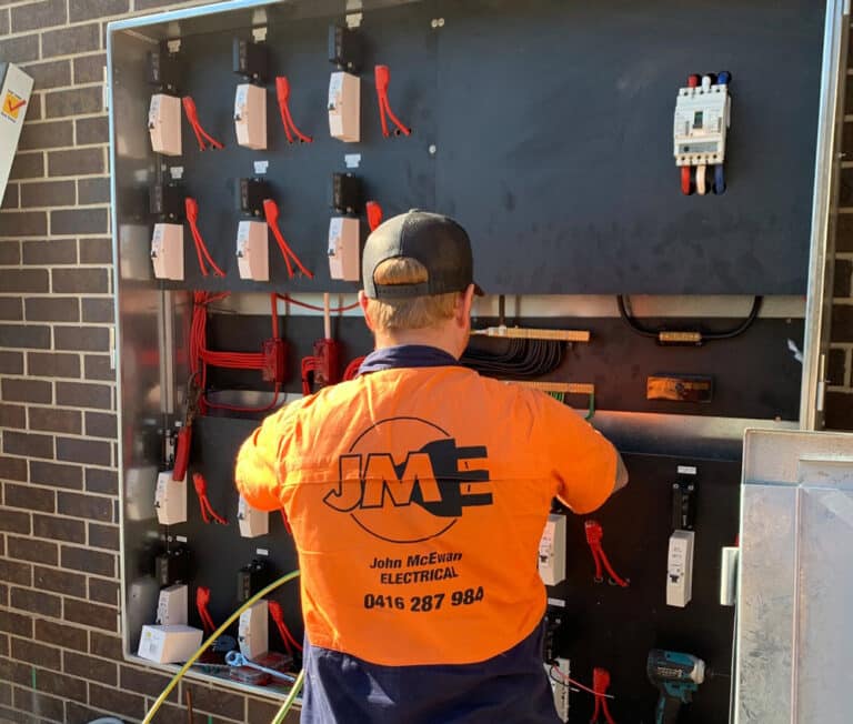 A Level 2 Electrician In An Orange Shirt