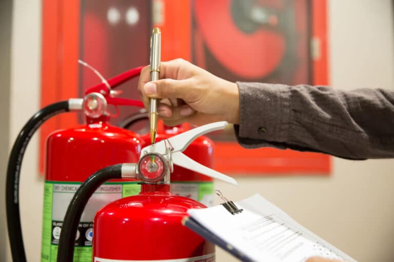 A Local Electrician Inspecting Fire Extinguisher