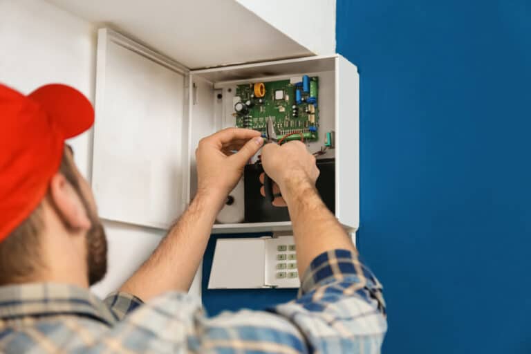 Electrian Repairing A Circuit Board