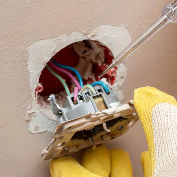 Electrician Checking An Outlet